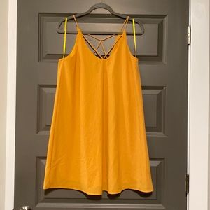 Gold dress, skinny straps, back strap design
